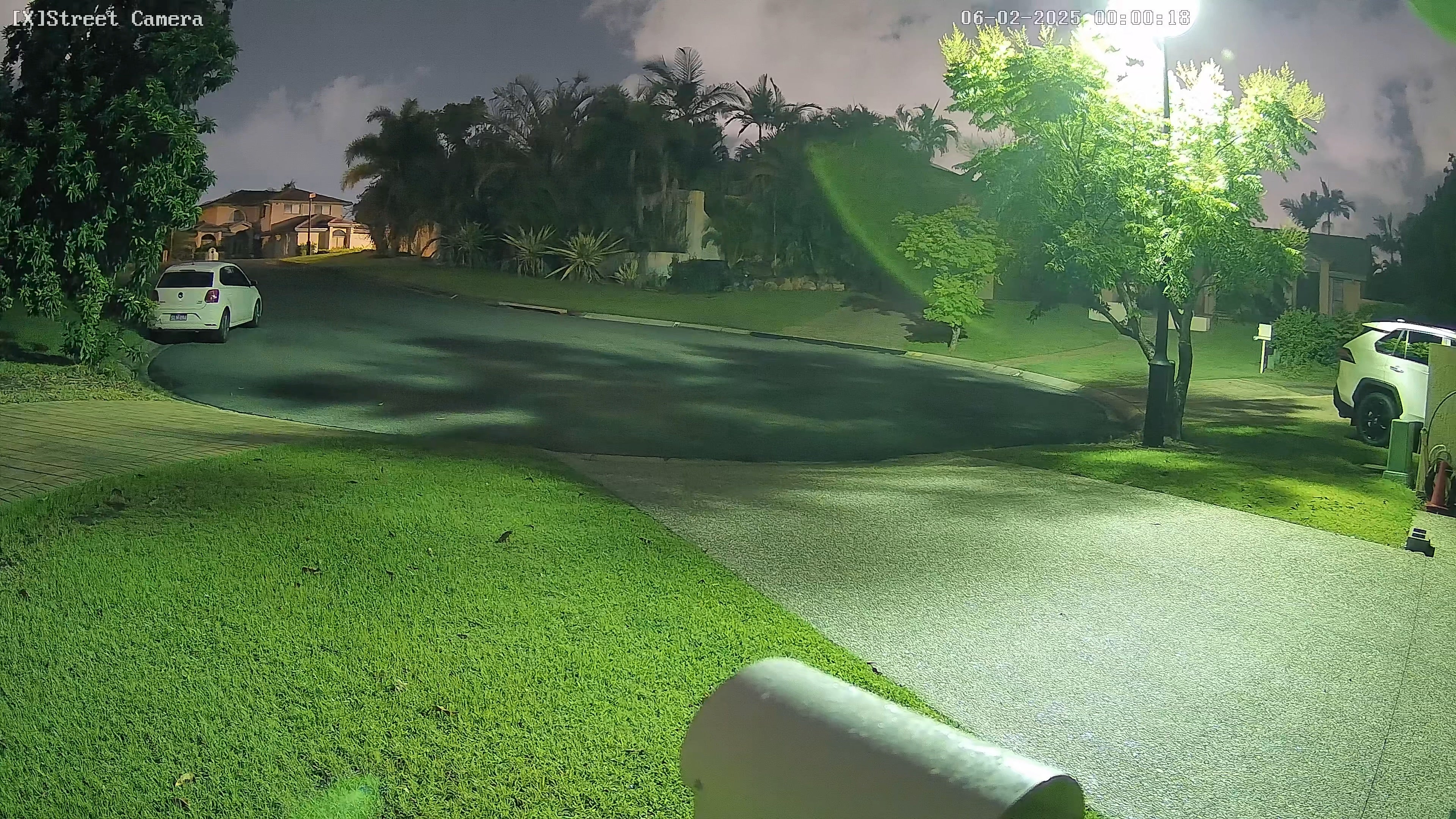 Night view of a residential street captured by NYX D8F COLOUR24 8MP security camera with clear color imaging